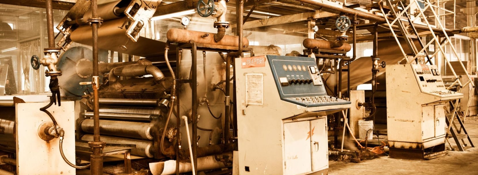 Vintage industrial machinery and control panels on a factory floor